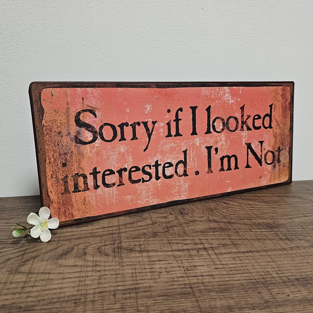 oblong shape tin metal sentiment sign orange/red colour with distressed finish Sorry if I Looked Interested. I'm Not