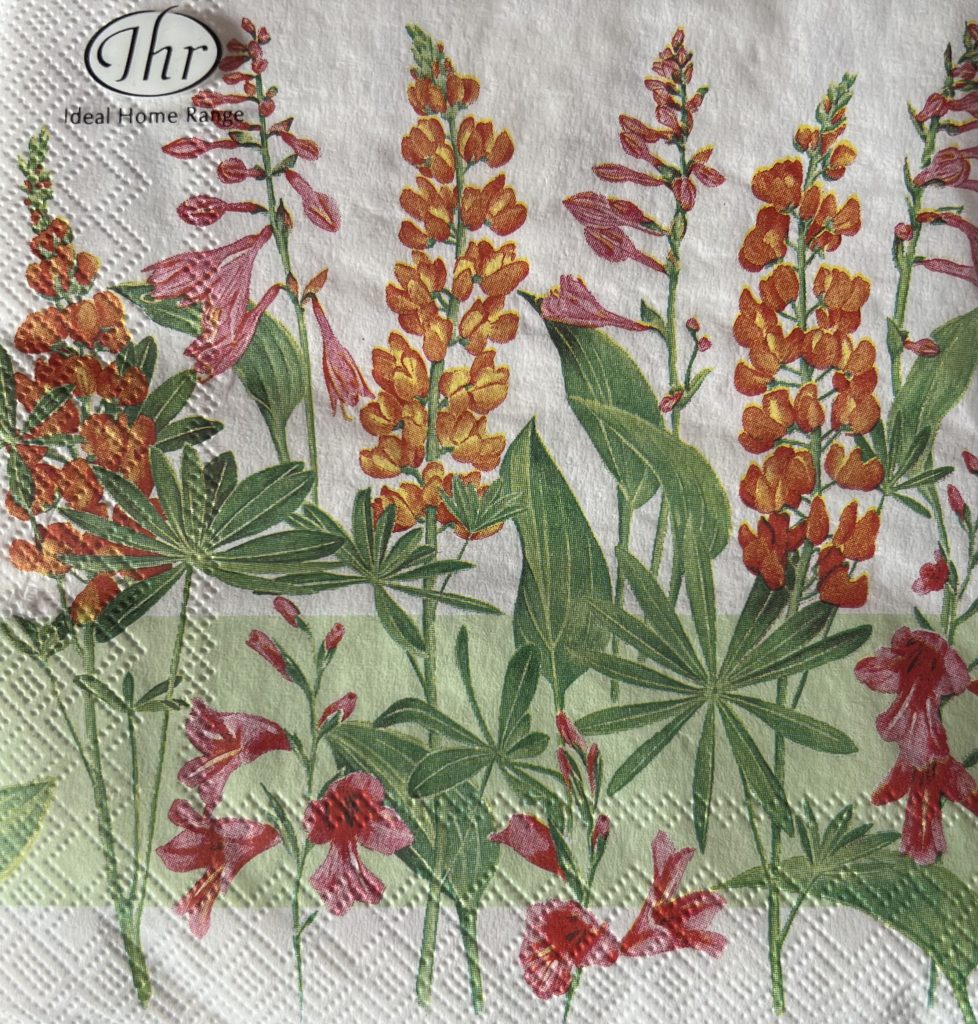 full packet x 20 3ply lupin flower paper napkins lunch size by IHR featuring an illustration of orange and pink colour lupins with green foliage on a white background